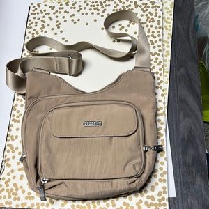Baggalini crossbody tan and purple interior